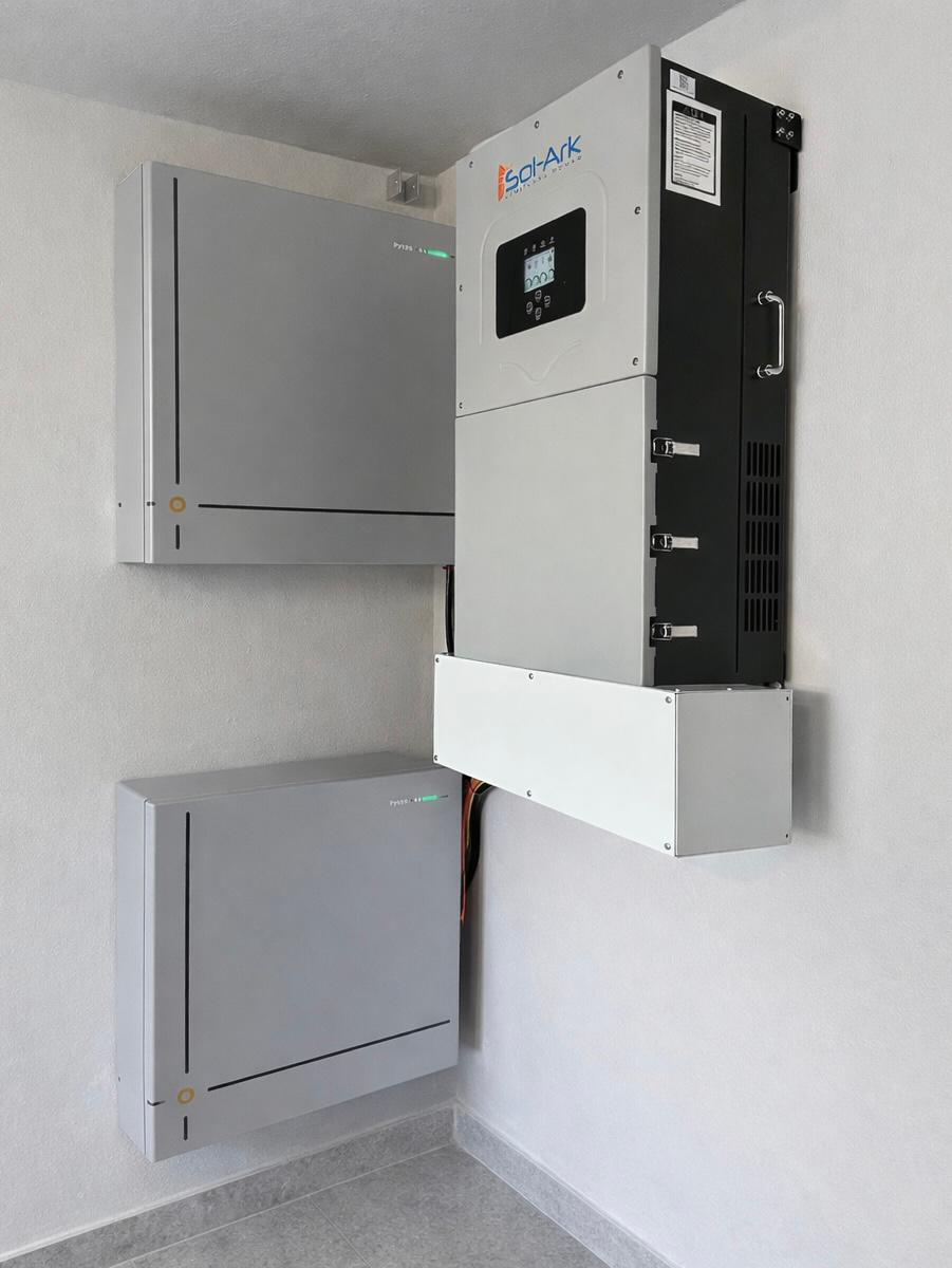 Integrated home energy storage batteries and inverter installed on a wall
